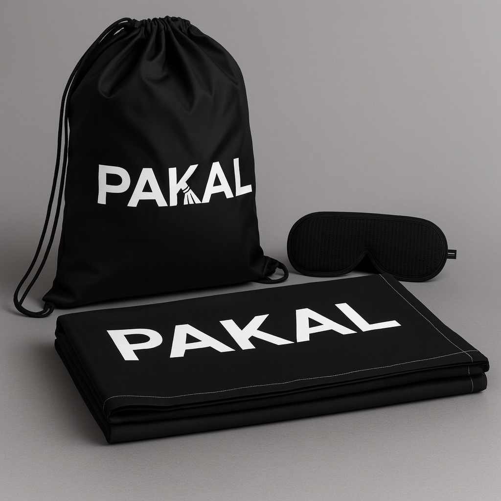 Black drawstring bag, mat, and eye mask with 'PAKAL' branding on a gray background