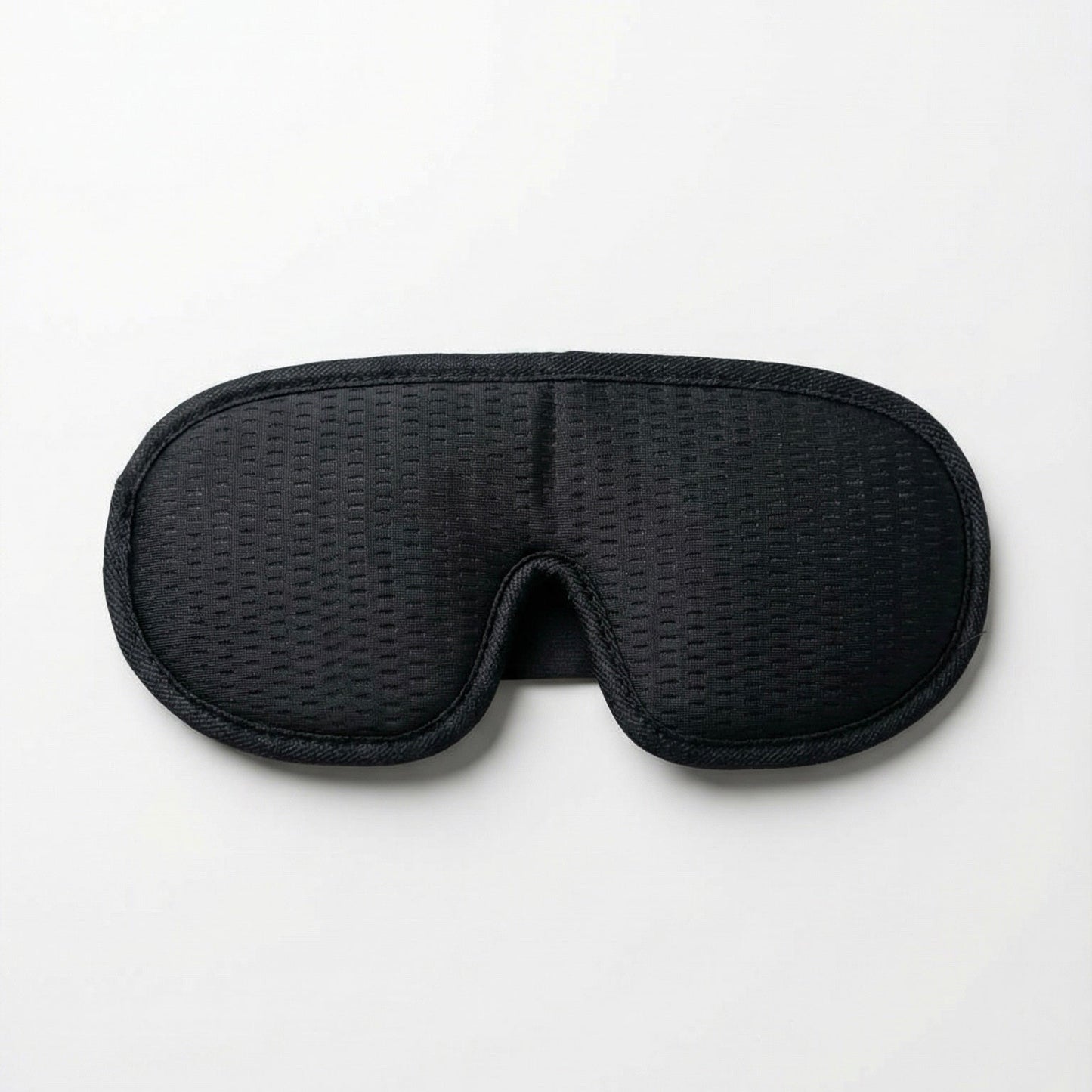 Black woven eye mask on a white background