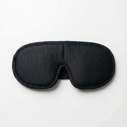 Black woven eye mask on a white background