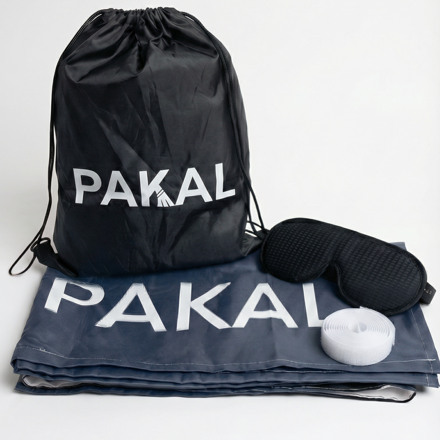 Black drawstring bag and gray mat with 'PAKAL' branding on a white background