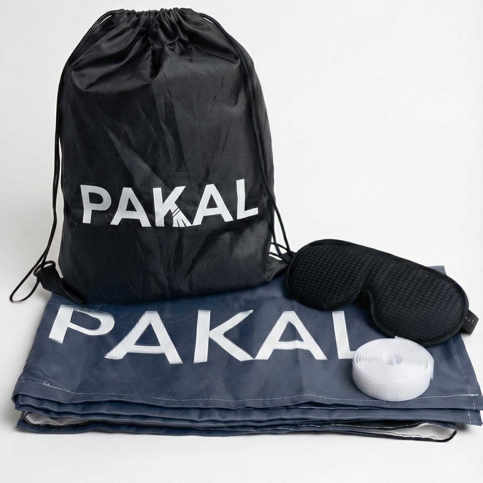 Black drawstring bag and gray mat with 'PAKAL' branding on a white background